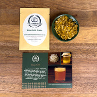 Fermentation station water kefir grains and packaging on a wooden surface